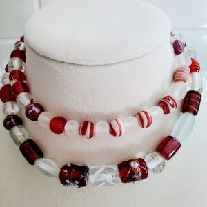 Festive Red and White Glass Beads with Intricate Detailing
